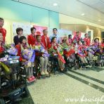 21 Sept 2016 - Minister Tan Chuan-Jin and Team Singapore's Paralympians pose for photos on their arrival at Changi Airport