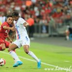 15 July 2022 Fabio Carvalho of Liverpool and Kaden Rodney of Crystal Palace in action while Jurgen Klopp of Liverpool looks from the sideline during the Standard Chartered Singapore Trophy 2022 match between Liverpool and Crystal Palace at the Singapore National Stadium